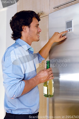 Image of Man near fridge