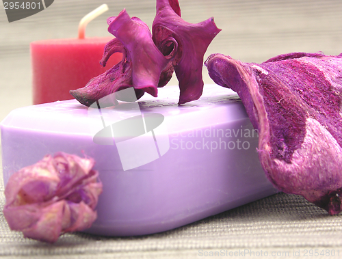 Image of Lilac soap with decoration articles on a  gray  background