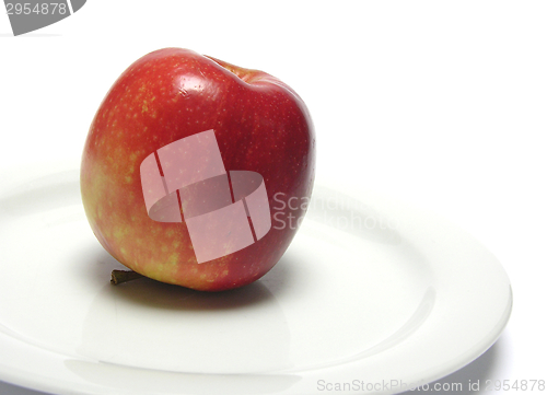Image of Red apple on a white plate