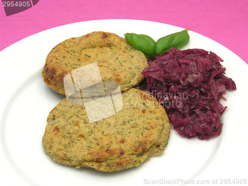 Image of Round flat potato dough cakes with basil and red cabbage