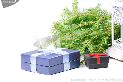 Image of Christmas gifts, green spruce and lantern