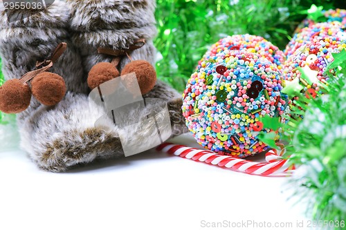 Image of Green tinsel with snow boots decoration