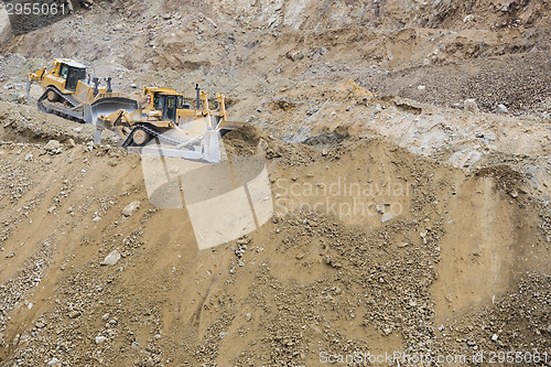 Image of Excavator Tractors Moving Dirt