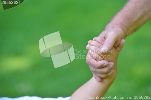 Image of happy grandfather and child in park