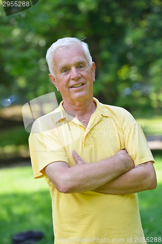 Image of happy grandfather and child in park