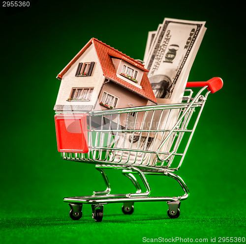 Image of shopping cart and house