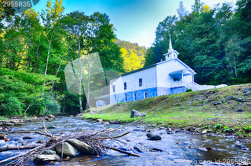 Image of church in the mountains by the river