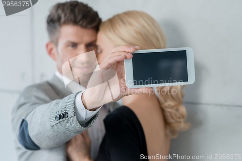 Image of Young Sweet Couple Taking Self Photos
