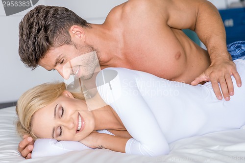 Image of Sweet Sexy Caucasian Couple Lying on White Bed