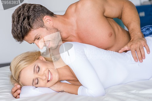 Image of Sweet Sexy Caucasian Couple Lying on White Bed