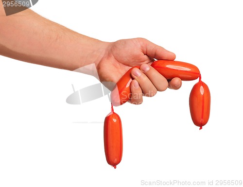 Image of Hand with sausage