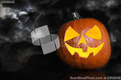 Image of Pumpkin on a black cloudy background for Halloween