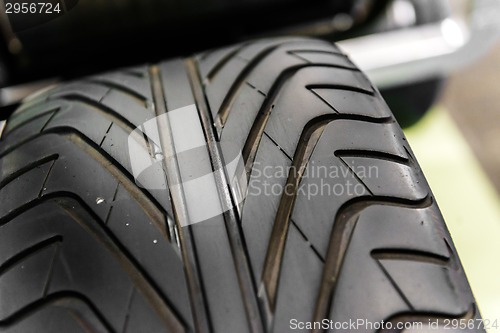 Image of New car tyre closeup photo