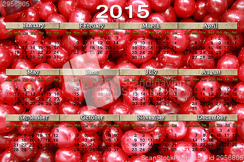 Image of calendar for 2015 on the red cherries background