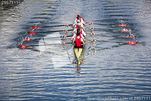 Image of Eight men rowing 