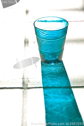 Image of blue empty glass with reflection