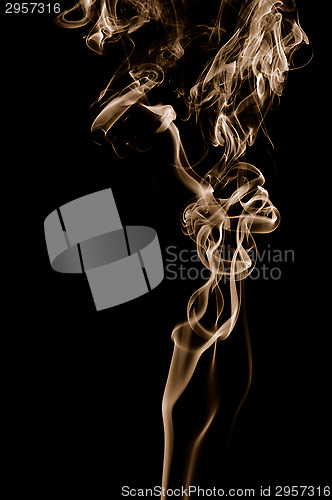 Image of Golden smoke on black background