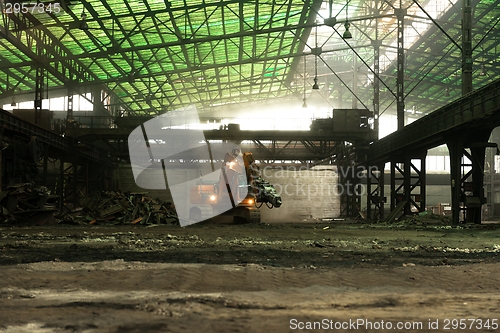 Image of Industrial interior with bulldozer inside