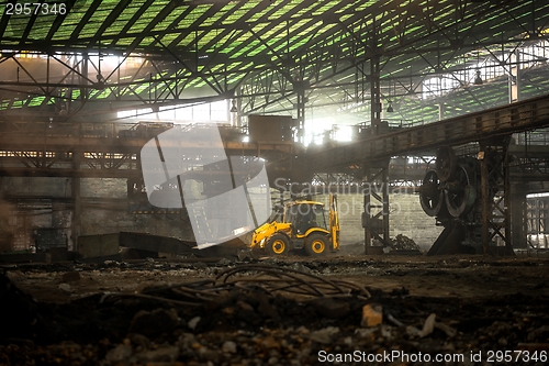 Image of Industrial interior with bulldozer inside