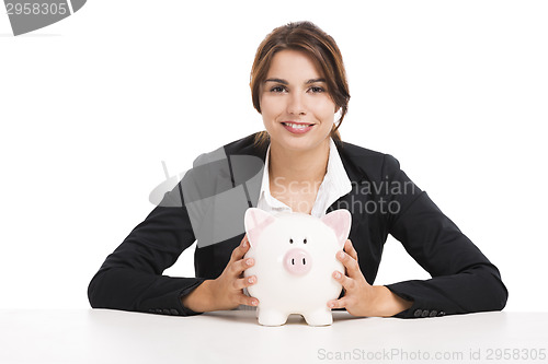 Image of Businesswoman with a piggy bank