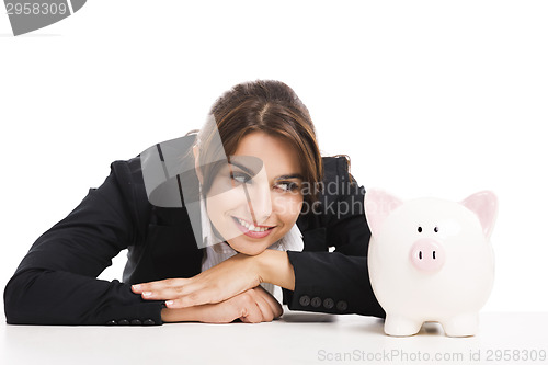 Image of Businesswoman with a piggy bank