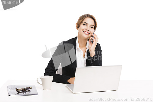 Image of Businesswoman answering phone