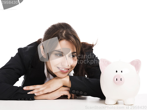 Image of Businesswoman with a piggy bank