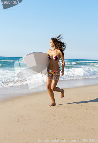 Image of Surfer girl at the beach