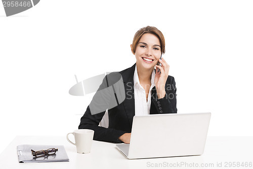 Image of Businesswoman answering phone