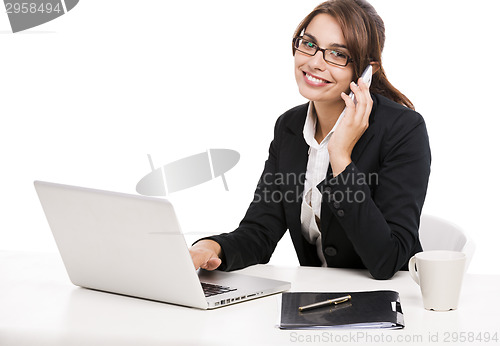 Image of Businesswoman answering phone