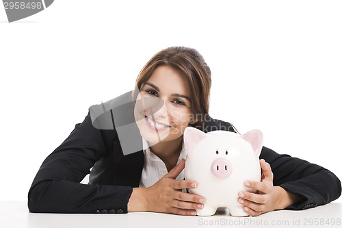 Image of Businesswoman with a piggy bank