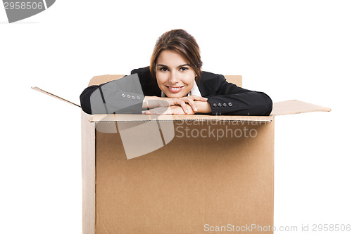 Image of Business woman appear inside a big card box