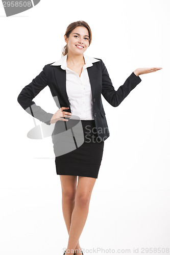 Image of Business woman showing something