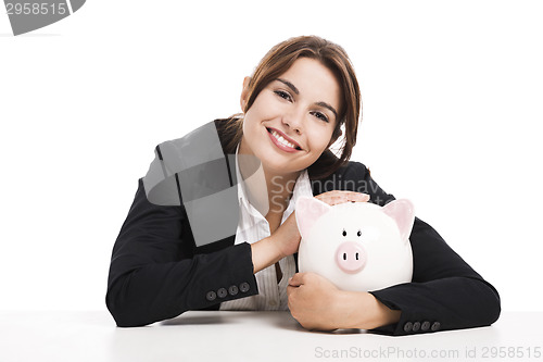 Image of Businesswoman with a piggy bank