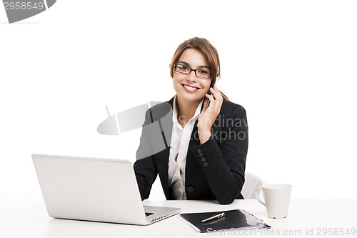 Image of Businesswoman answering phone