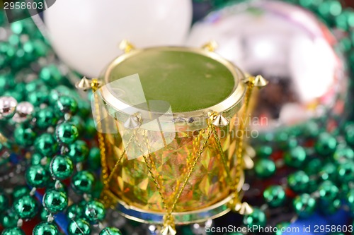 Image of Christmas decorations, new year invitation card, drums, pearls and xmas balls