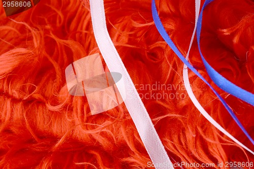 Image of Red background with white and blue ribbon