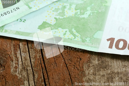Image of Close-up of  100 Euro banknotes isolated on white background.