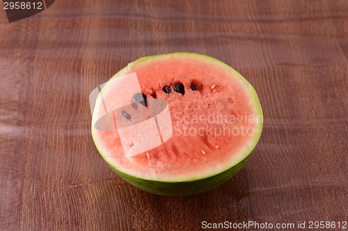 Image of fresh watermelon fruit on wooden background