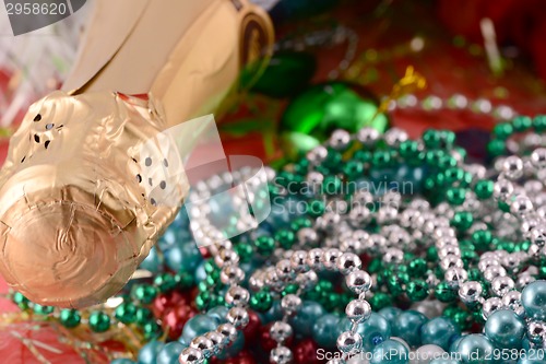 Image of Beautiful ornaments, champagne, pearl and balls as a New Year decoration