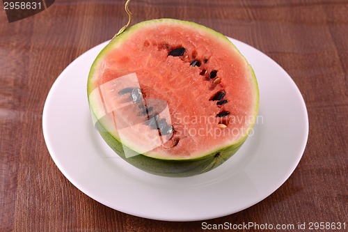 Image of fresh watermelon fruit on wooden background