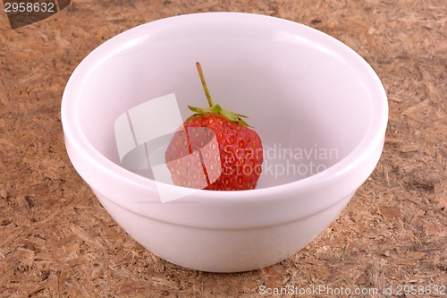 Image of Fresh ripe strawberries on a vintage wooden background