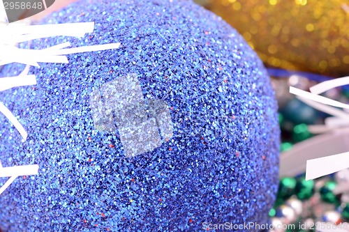 Image of blue and yellow christmas balls, new year decoration