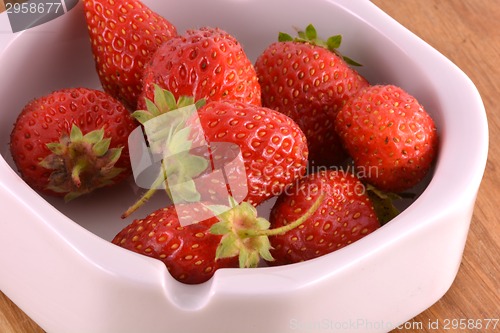 Image of Fresh ripe strawberries on a vintage wooden background