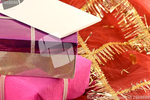 Image of A red gift with a white ribbon and a bow