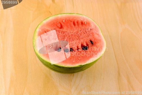 Image of fresh watermelon fruit on wooden background