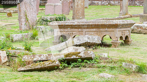Image of Very old broken gravestone in the cemetery