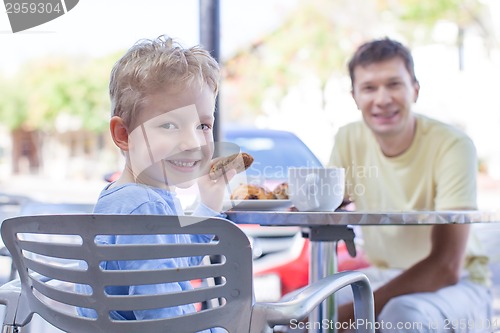 Image of family at cafe