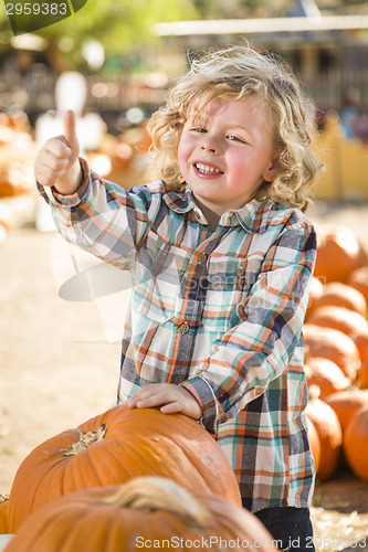 Image of Cute Little Boy Gives Thumbs Up at Pumpkin Patch