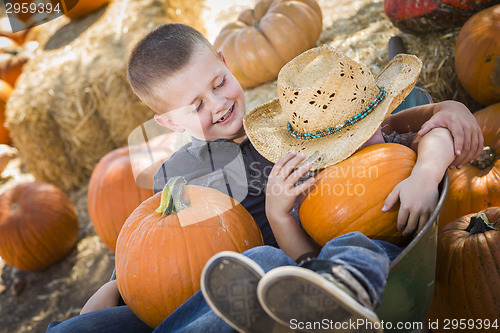 Image of Two Little Boys Playing in Wheelbarrow at the Pumpkin Patch